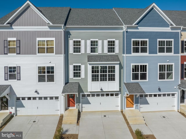 multi unit property featuring a garage