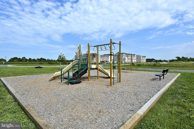 view of playground with a yard