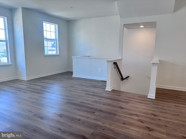 empty room with dark wood-type flooring