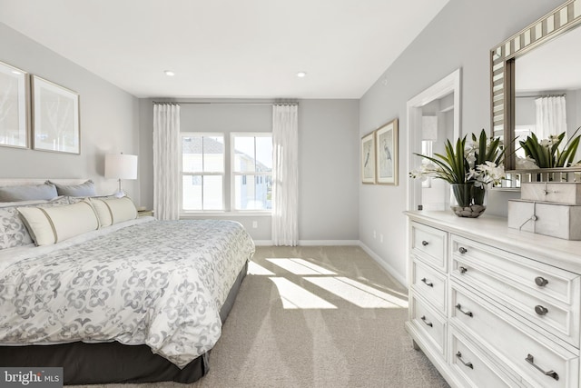 bedroom featuring light colored carpet