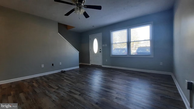 foyer with dark hardwood / wood-style floors and ceiling fan