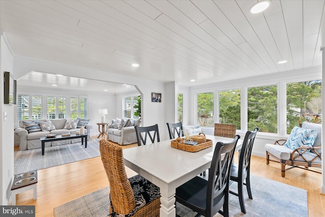 dining space featuring plenty of natural light and light hardwood / wood-style floors