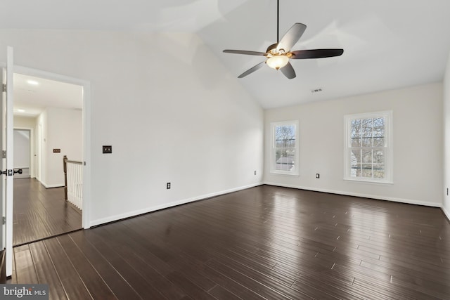 unfurnished living room featuring lofted ceiling, dark hardwood / wood-style floors, and ceiling fan