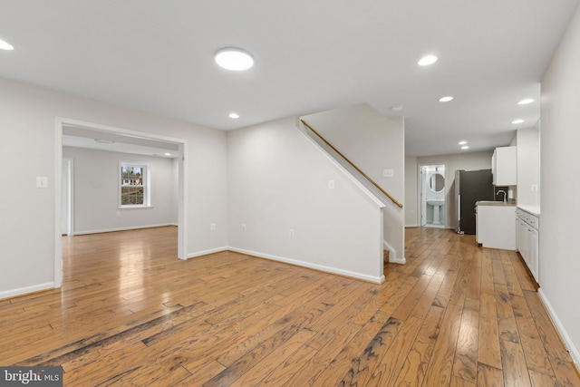 interior space featuring sink and light hardwood / wood-style floors