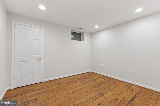 empty room with hardwood / wood-style floors