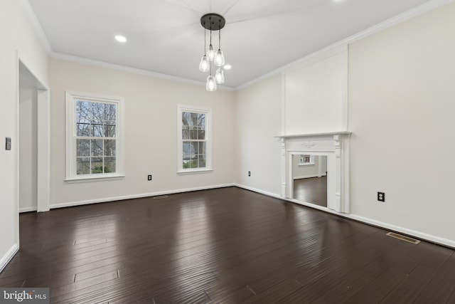 unfurnished living room featuring crown molding, a fireplace, and dark hardwood / wood-style floors