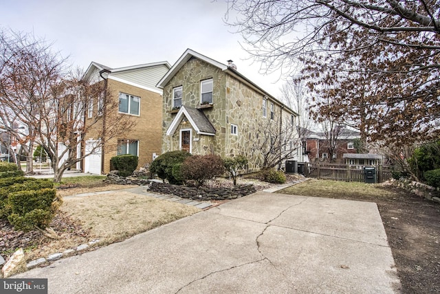 view of front property featuring central AC unit