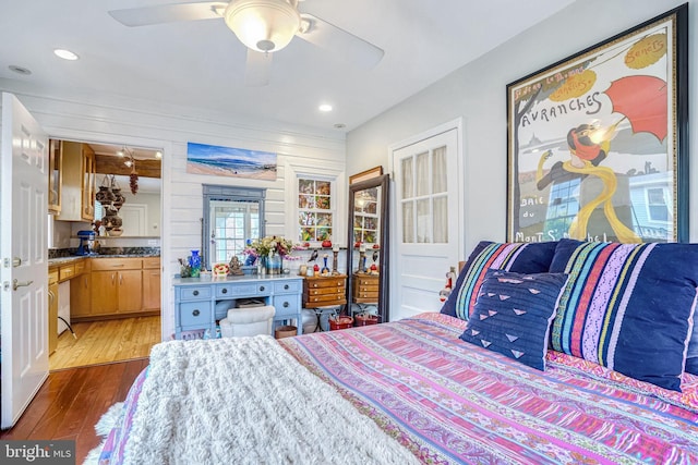 bedroom featuring dark hardwood / wood-style flooring and ceiling fan