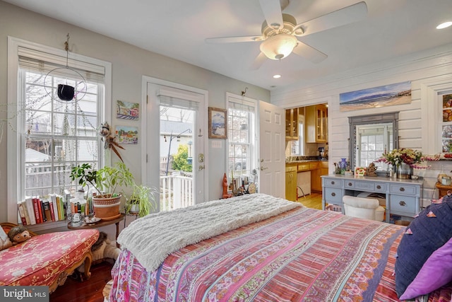 bedroom with ceiling fan, connected bathroom, access to exterior, and light hardwood / wood-style flooring