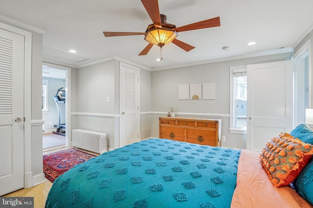 bedroom with ceiling fan, ornamental molding, radiator, and light tile patterned floors