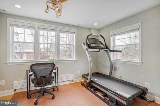 workout area with baseboard heating