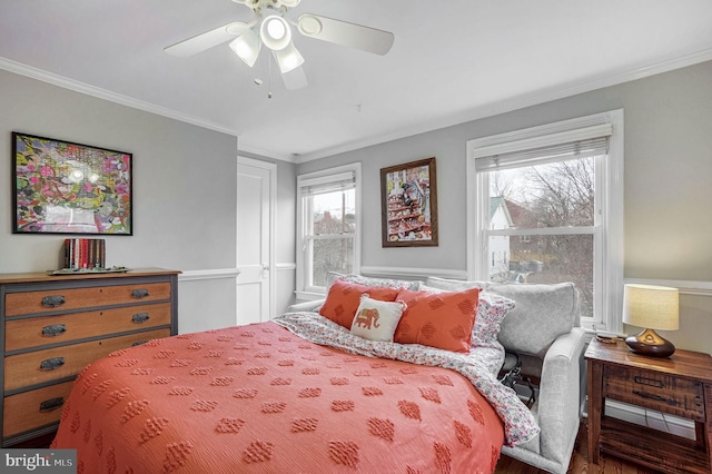 bedroom with crown molding and ceiling fan