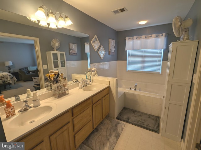 full bathroom featuring visible vents, a sink, ensuite bathroom, and a bath