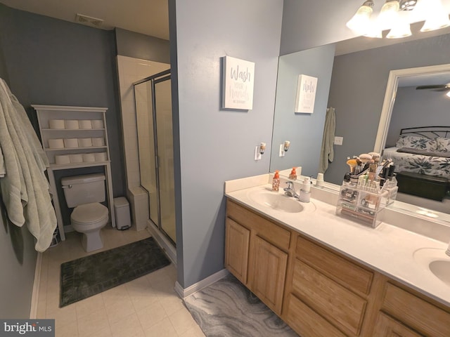 bathroom featuring double vanity, visible vents, a stall shower, a sink, and ensuite bath