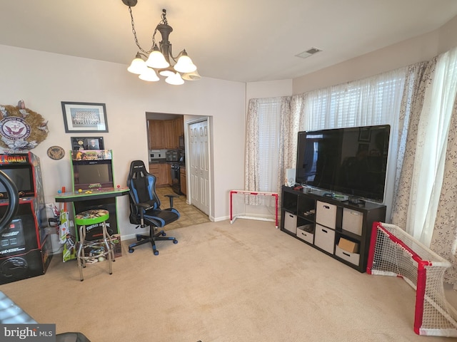 home office with light carpet, a chandelier, and visible vents