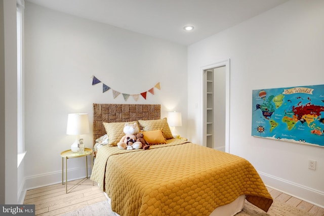 bedroom with hardwood / wood-style floors