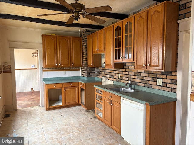 kitchen with sink, tasteful backsplash, white dishwasher, beamed ceiling, and ceiling fan