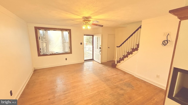 entryway with hardwood / wood-style floors and ceiling fan