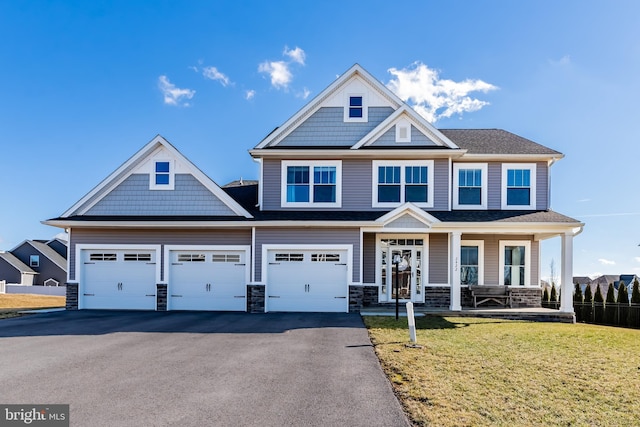 craftsman-style home featuring a porch and a front lawn