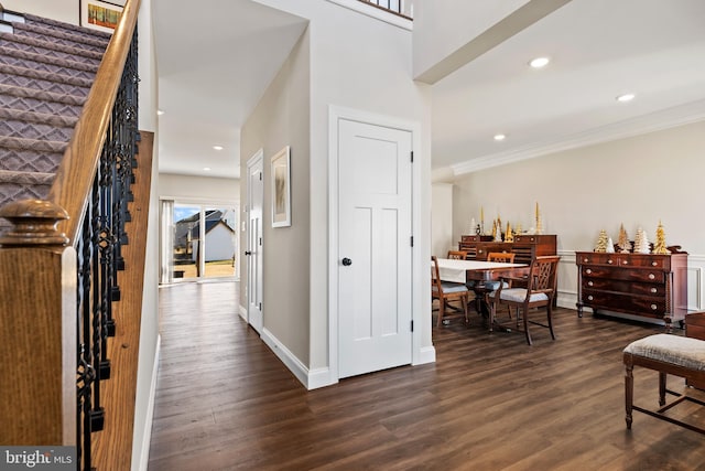 interior space featuring crown molding and dark hardwood / wood-style flooring