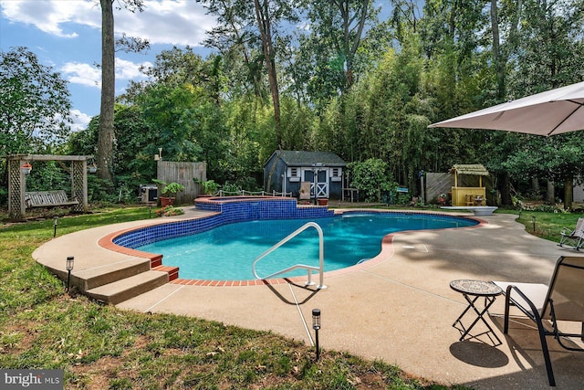 view of swimming pool featuring a playground, a patio area, and a shed