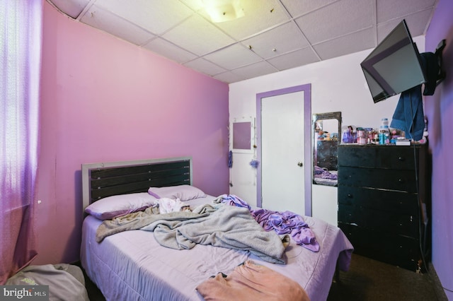 bedroom featuring a drop ceiling