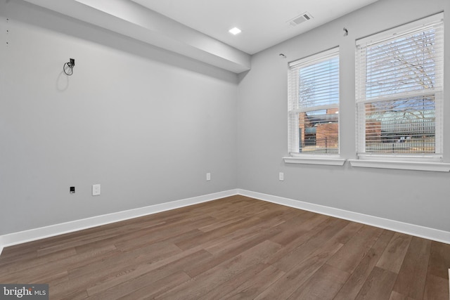 spare room featuring hardwood / wood-style flooring