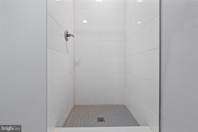 bathroom with tiled shower