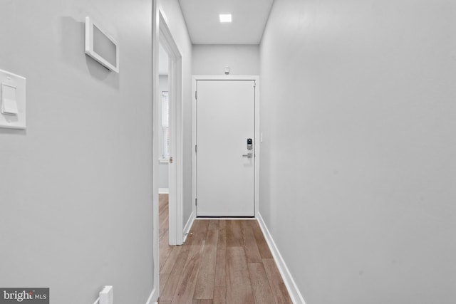 hall with light hardwood / wood-style floors