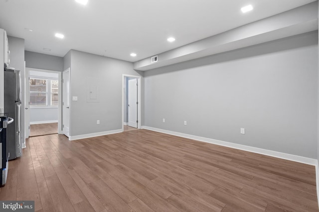 unfurnished living room featuring light hardwood / wood-style floors