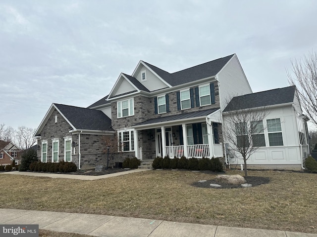 view of front facade with a front lawn and covered porch