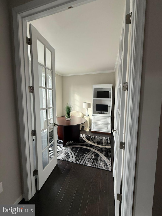 entryway with crown molding, dark hardwood / wood-style floors, and french doors