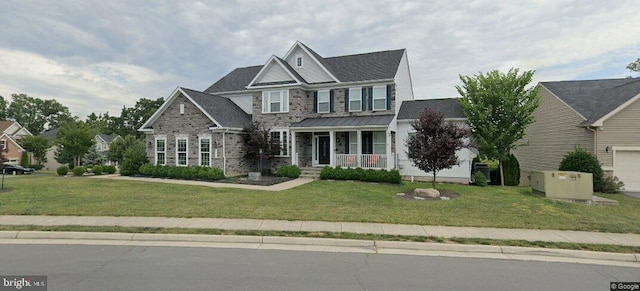 view of front facade with a front lawn and a porch