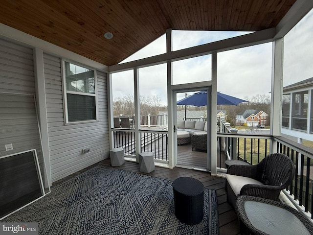 sunroom / solarium with lofted ceiling and wooden ceiling