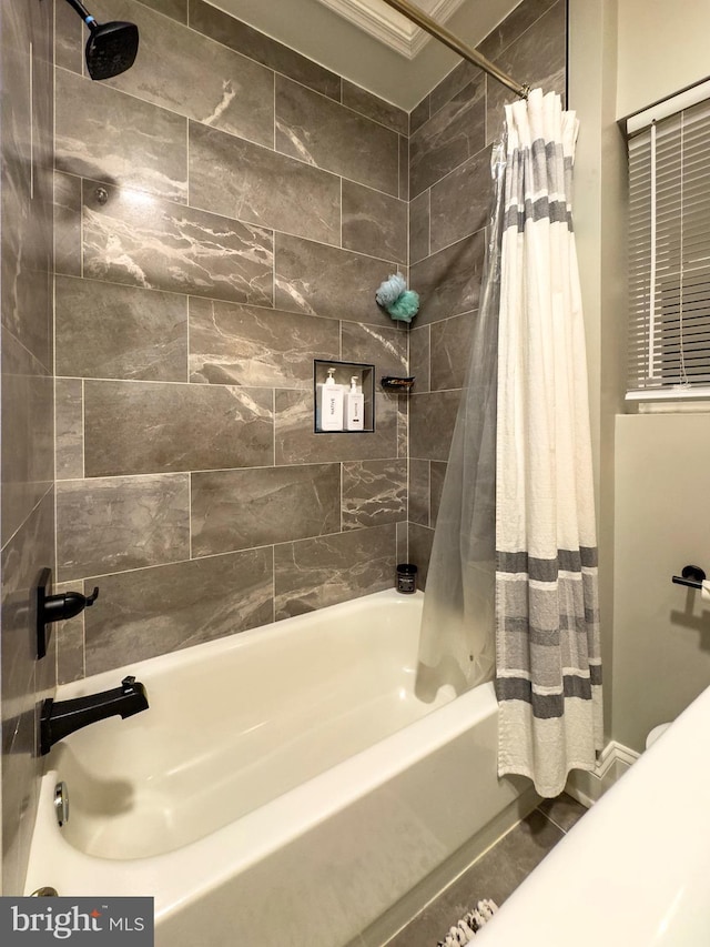 bathroom featuring shower / tub combo with curtain