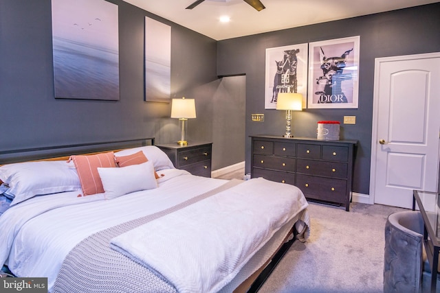 bedroom featuring light carpet and ceiling fan