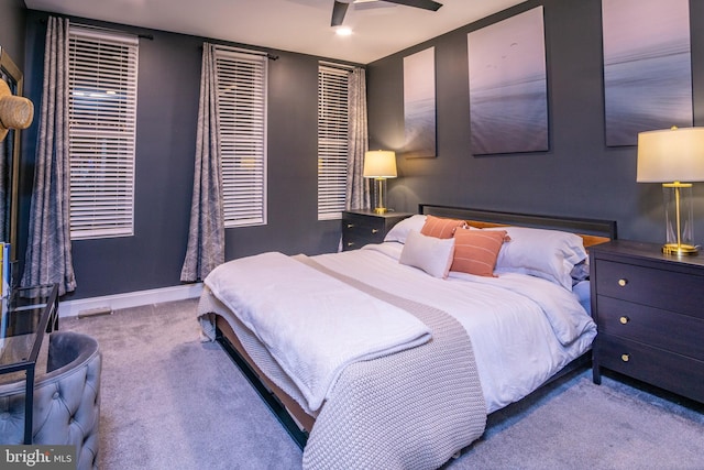 carpeted bedroom featuring ceiling fan