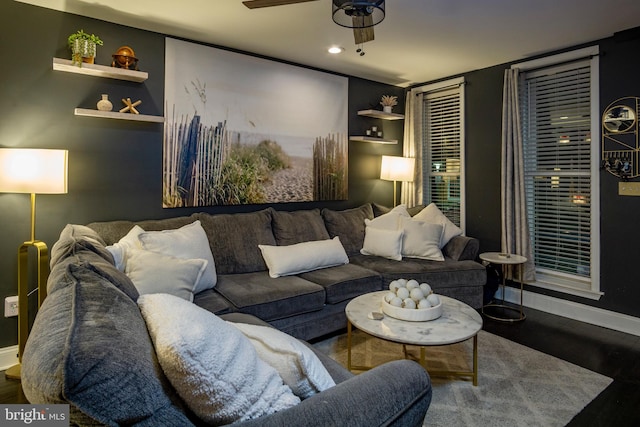 living room with hardwood / wood-style floors and ceiling fan