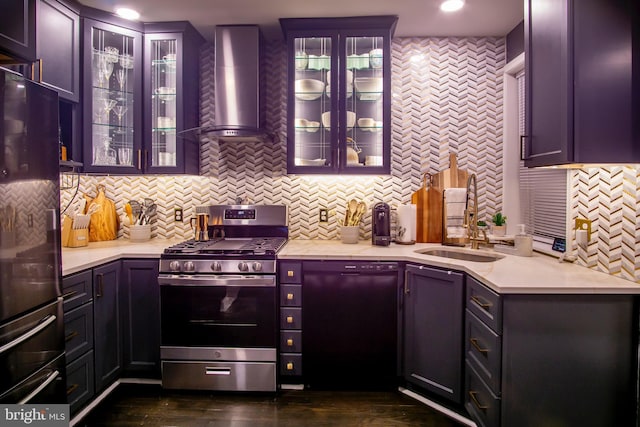 kitchen featuring sink, refrigerator, stainless steel gas stove, tasteful backsplash, and wall chimney exhaust hood