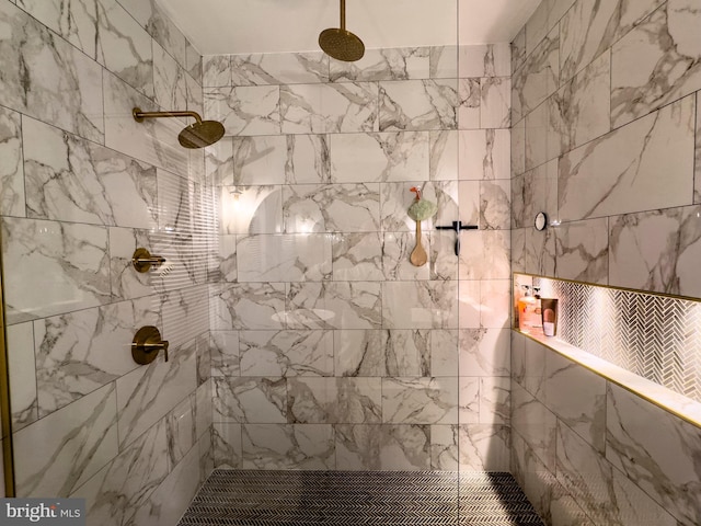 bathroom with a tile shower