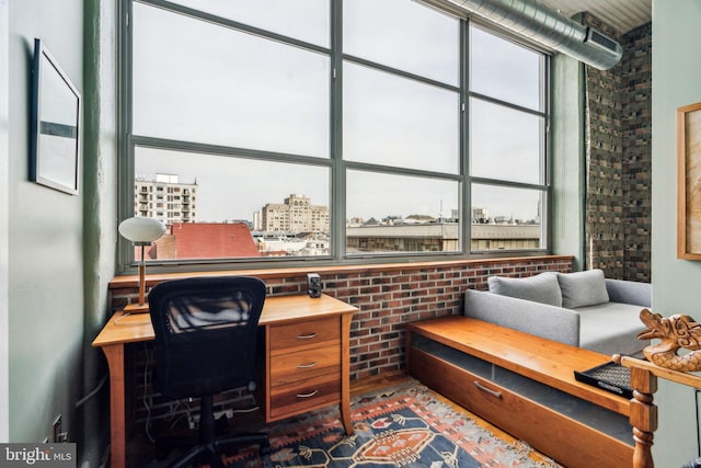 office with brick wall and plenty of natural light