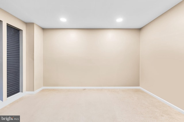 spare room with light colored carpet