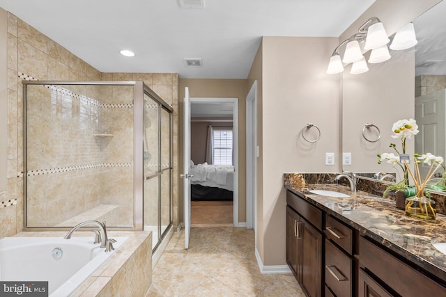 bathroom featuring vanity, tile patterned floors, and plus walk in shower