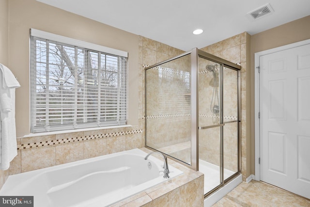 bathroom with plus walk in shower and tile patterned flooring