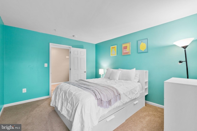 bedroom featuring light carpet