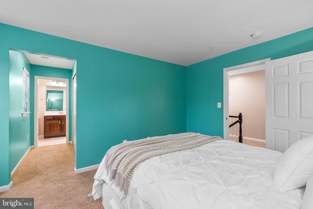 bedroom featuring light carpet