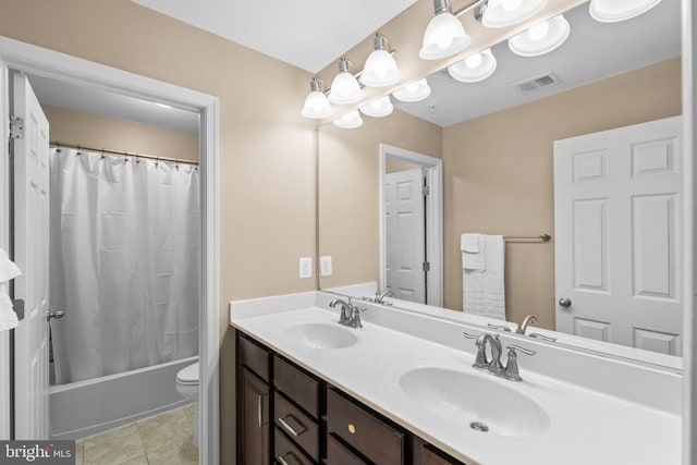 full bathroom featuring tile patterned floors, vanity, toilet, and shower / bath combo with shower curtain