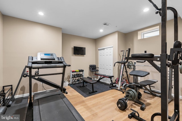 workout room featuring hardwood / wood-style flooring