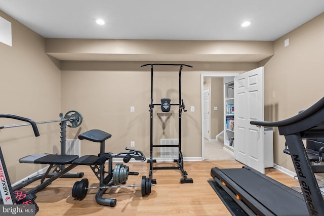 exercise area with hardwood / wood-style flooring