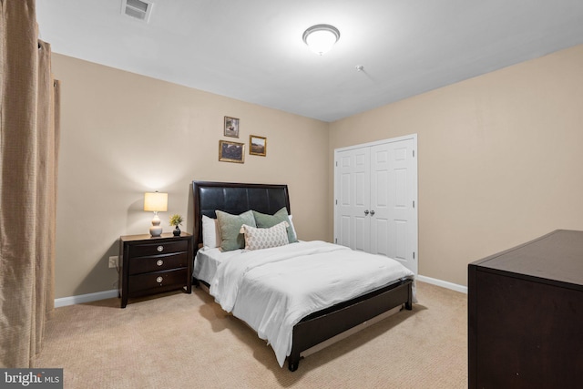 carpeted bedroom featuring a closet